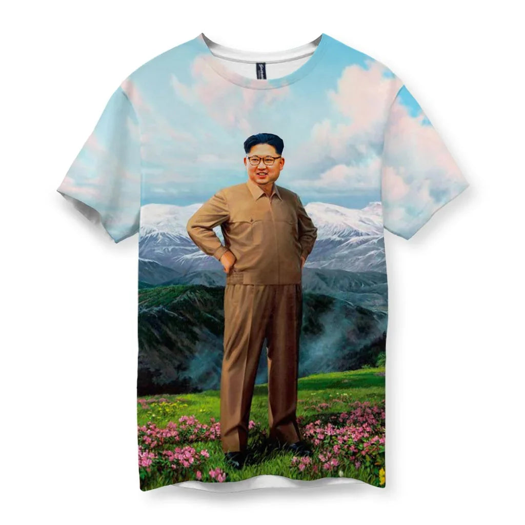 T-shirt with a printed design of Kim Jong Un standing in a scenic landscape with mountains and flowers.