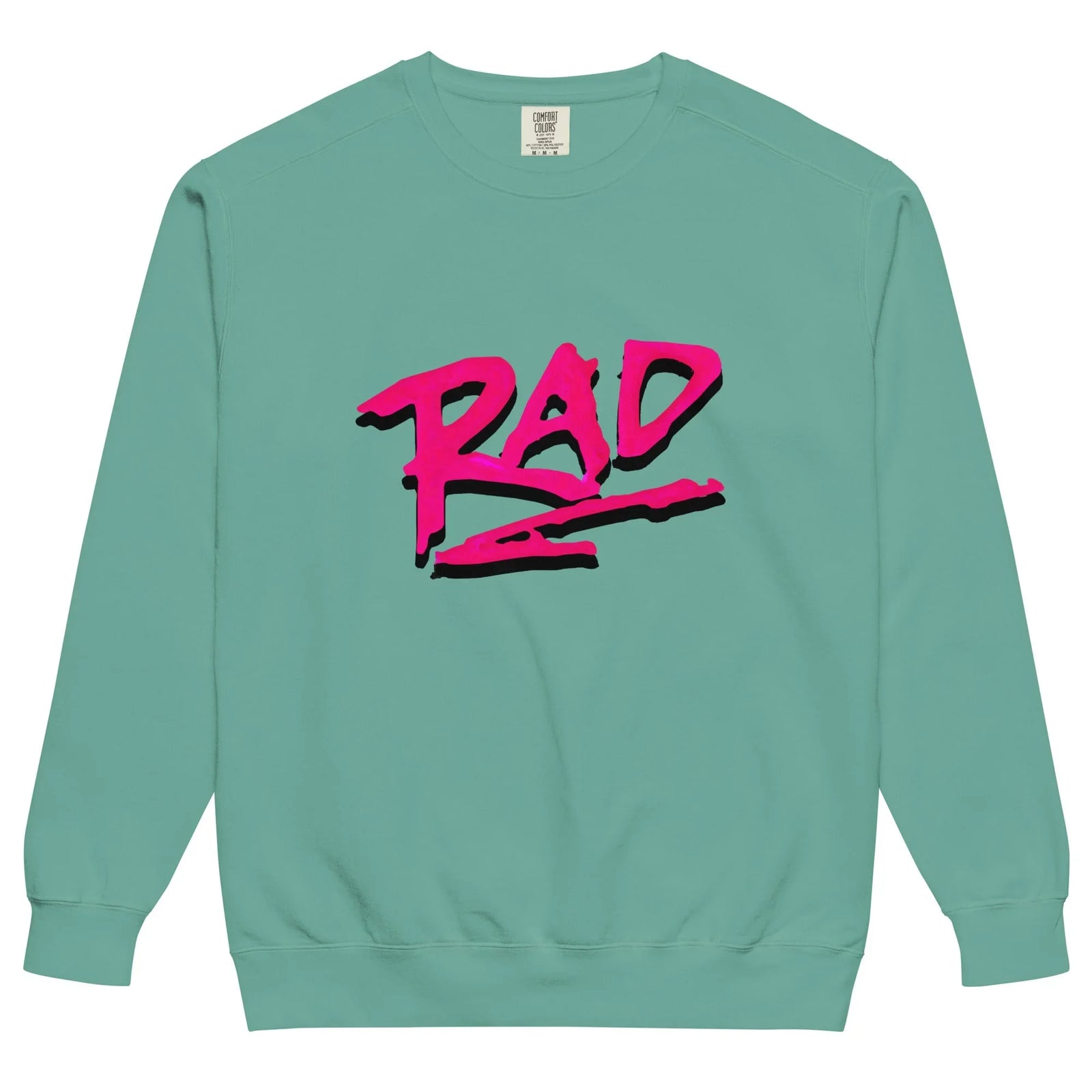 Just a Rad Sweatshirt - The jagged, aggressive "RAD" lettering in electric magenta (#FF007F) heavily shadowed in deep ink black (#000000) against the soft blossom pink backdrop (#F3CFE2).