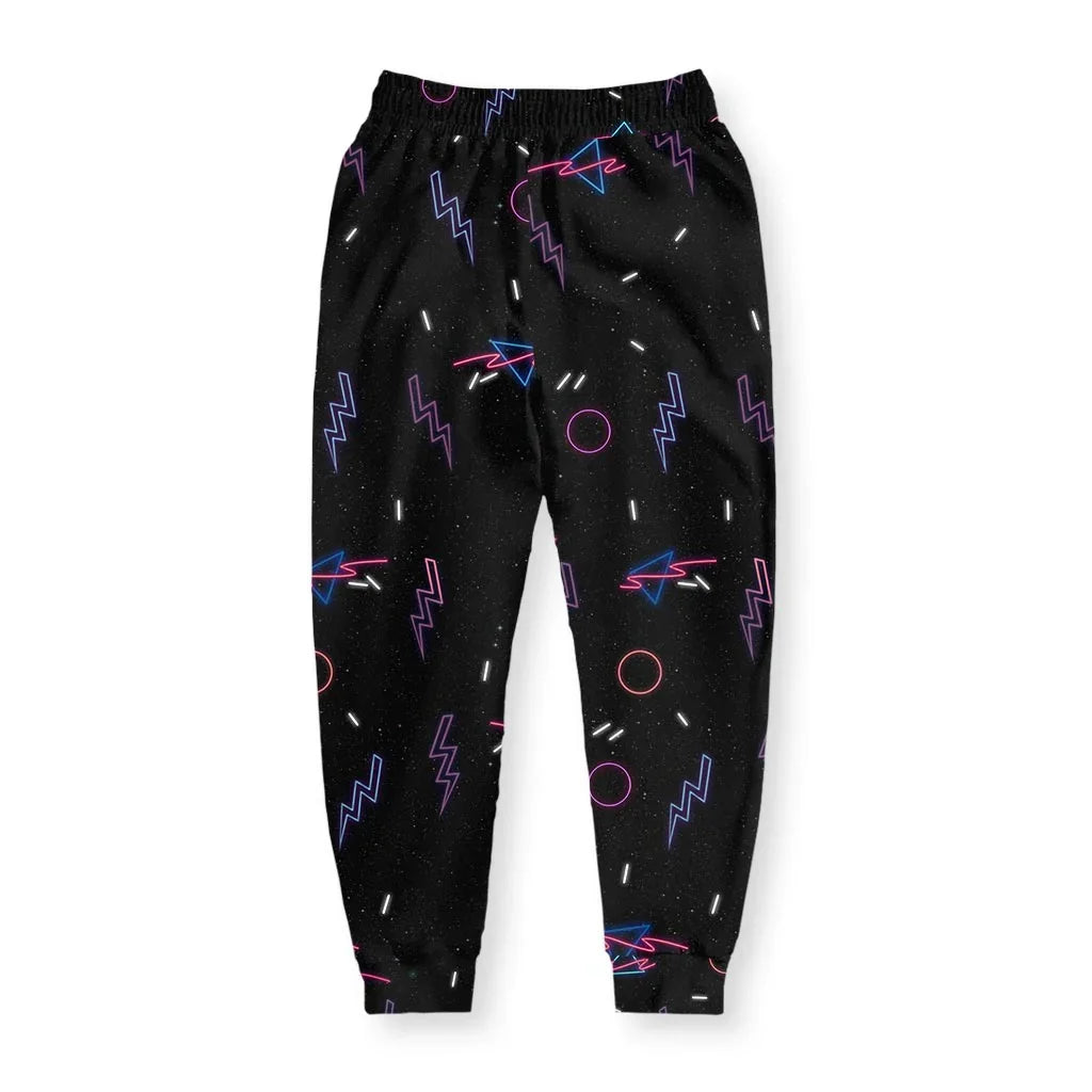 Retro Arcade Joggers - The specific "confetti and geometry" motif reminiscent of black-light responsive roller rink carpeting, anchored by the electric violet (#9400D3) and bright cyan (#00FFFF) primitive shapes.