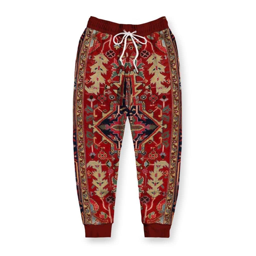 The Dudes Rug Joggers - The specific traditional Persian motif anchored in **Crimson Vermilion (#E34234)** and **Midnight Indigo (#191970)**, instantly recognizable not just as flooring, but as the catalyst for a noir-stoner saga