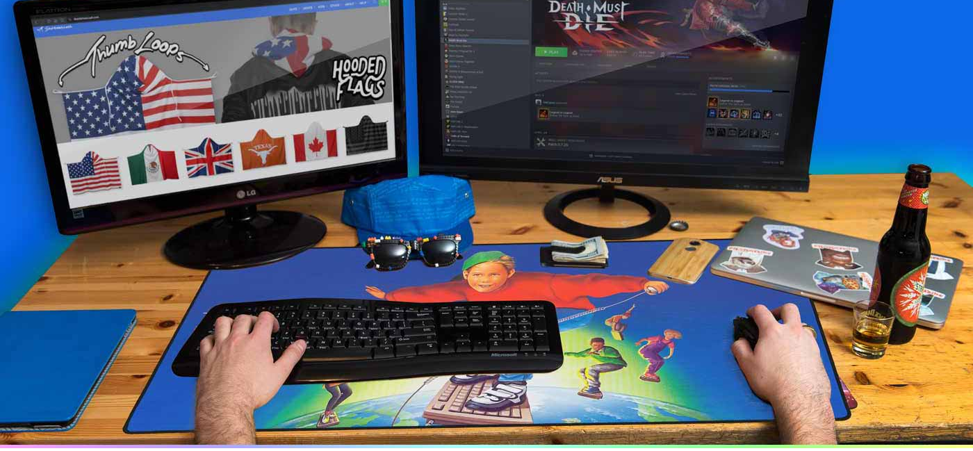 Person using a computer setup with two monitors on a desk, surrounded by gaming accessories.