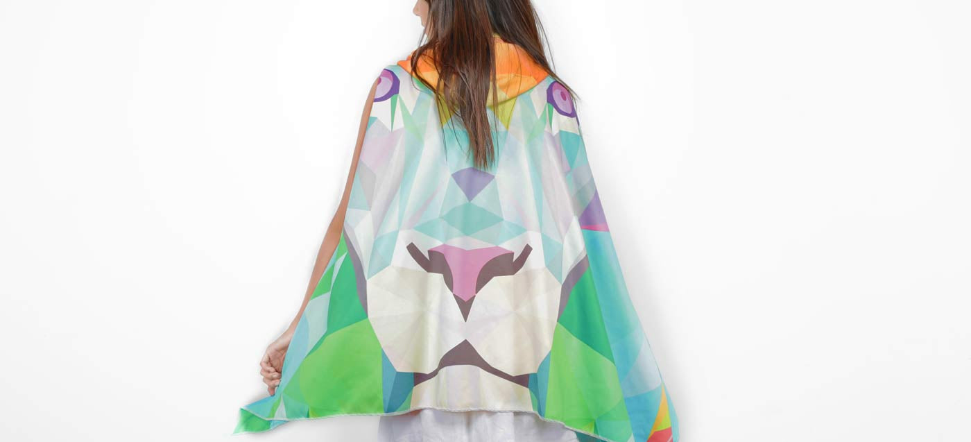 Woman wearing a colorful kimono-style garment on a white background