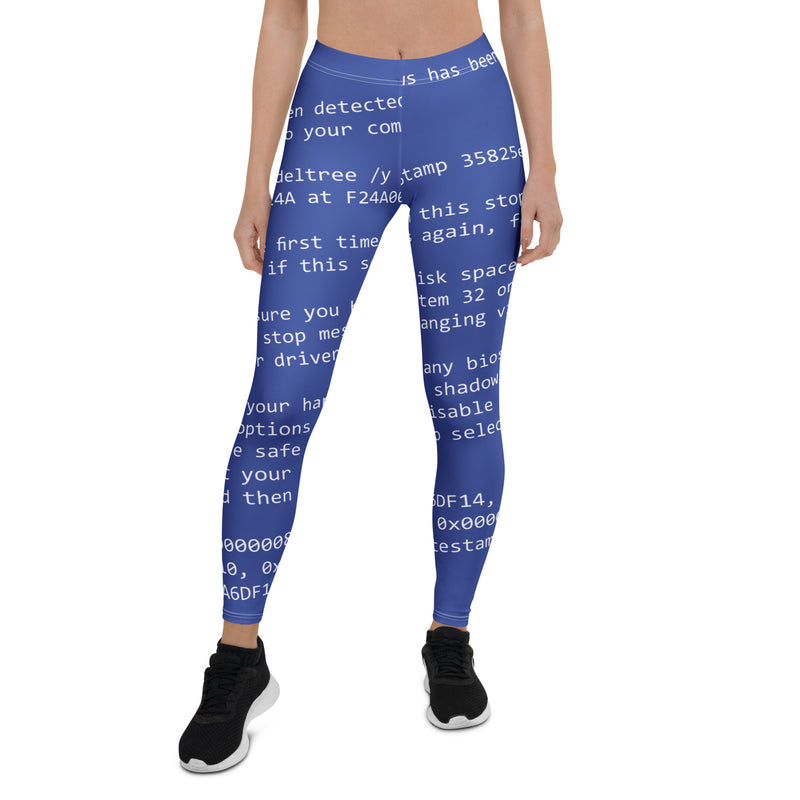 Woman wearing blue leggings with white error code print on right side