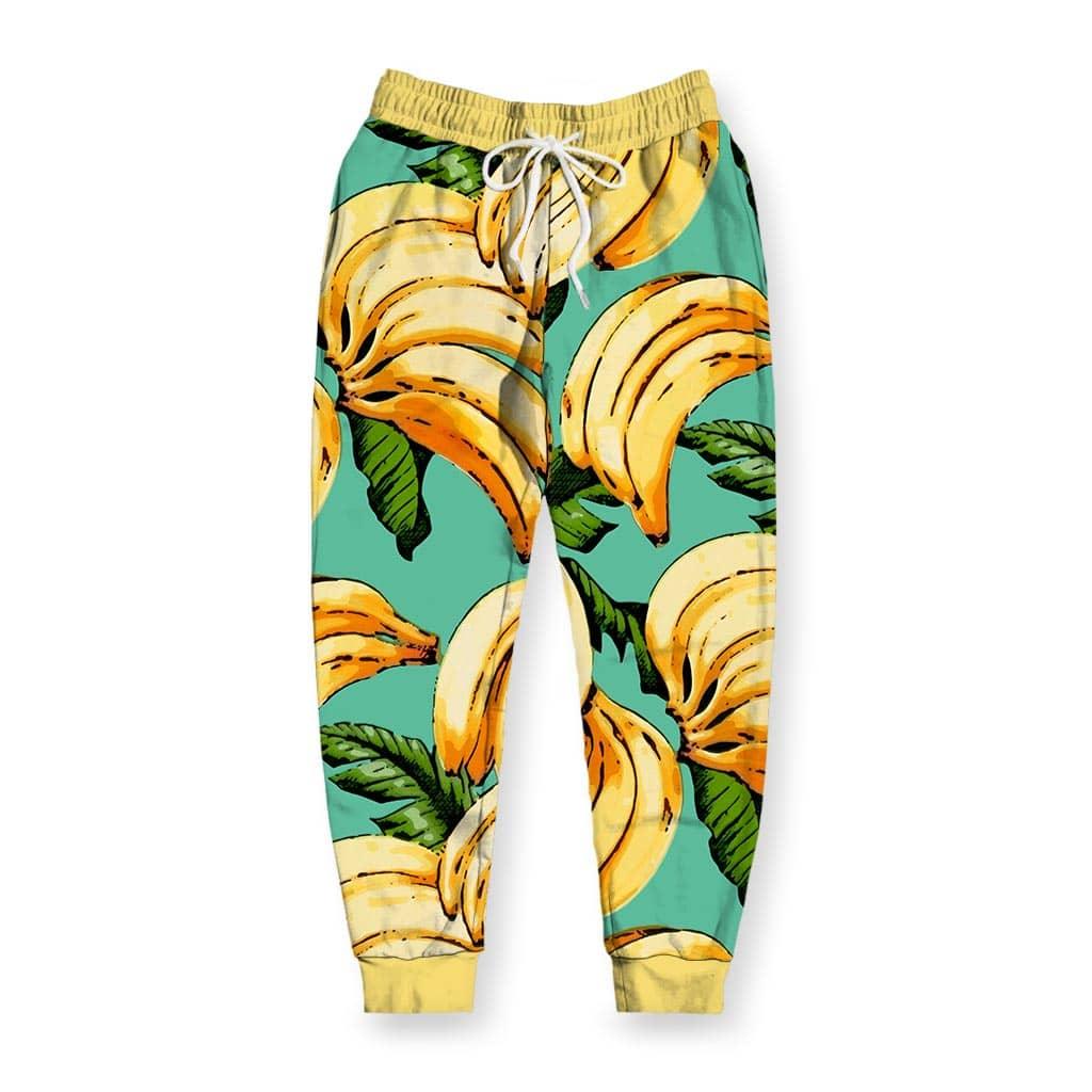 Oversized clusters of sun-ripened yellow bananas feature illustrative black sketch-like outlines (creating a hand-drawn graphic novel aesthetic) against a refreshing aquatic turquoise background. Contact us with accessibility feedback, we'd love to help!