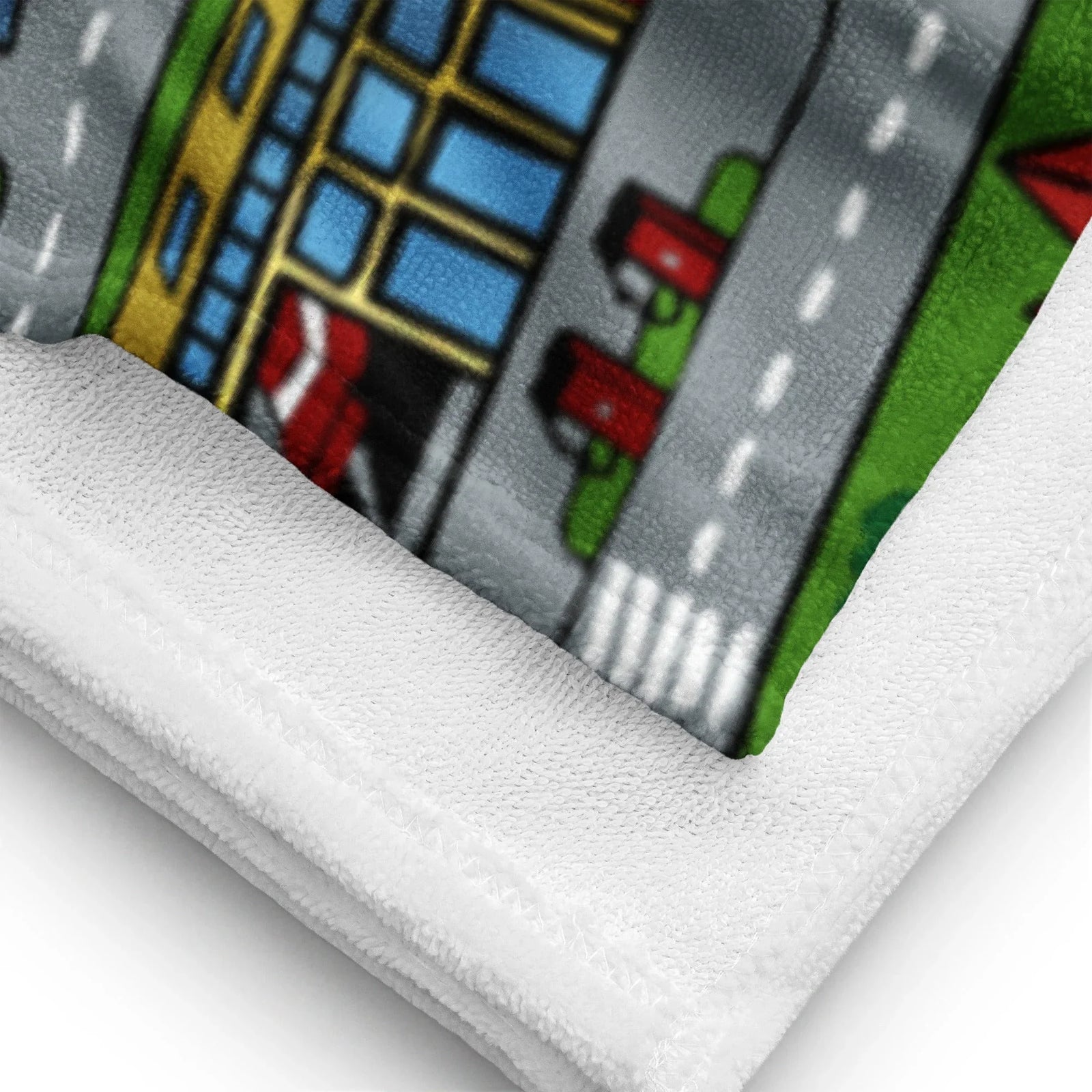 Car Carpet City Beach Towel - The distinctive interlocking asphalt grey (#9CA3AF) roadways winding through vibrant playground turf green (#4CAF50), instantly recalling the specific friction and visual language of a nylon bedroom floor mat.