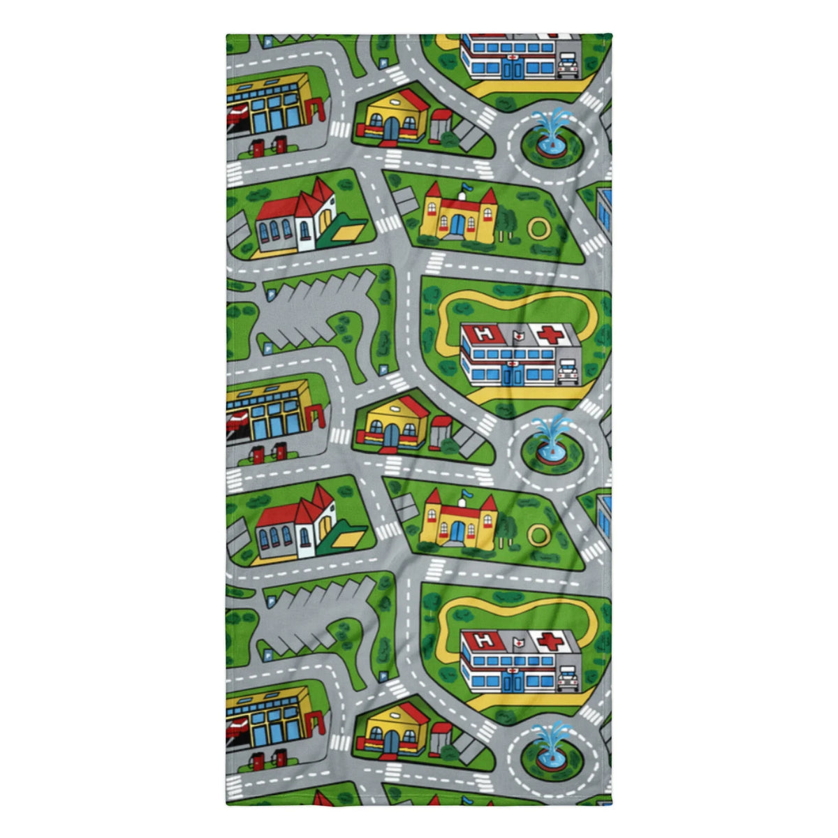 This beach towel showcases a nostalgic bird's-eye view of a miniature town playmat, complete with winding grey roads marked by white dashed lines curving around vibrant green parks. Contact us with accessibility feedback, we'd love to help!