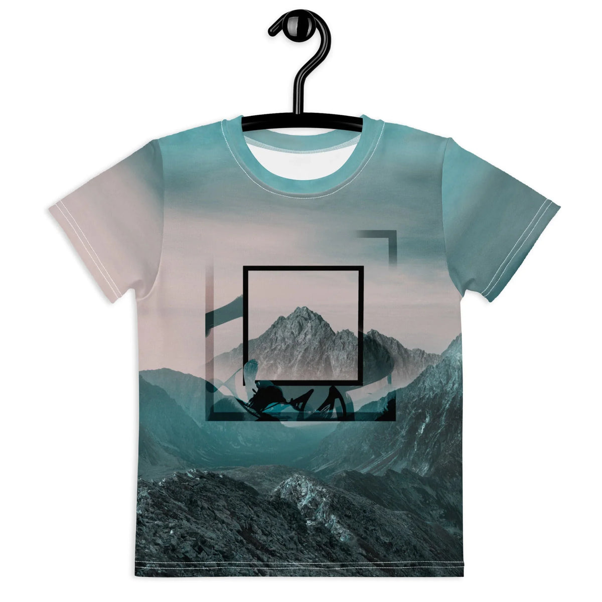 A photorealistic alpine landscape transforms this kid's tee into wearable art, featuring jagged rock faces in deep slate grays ascending into a valley bathed in cool teal mists and dusty rose hues. Contact us with accessibility feedback, we'd love to help!