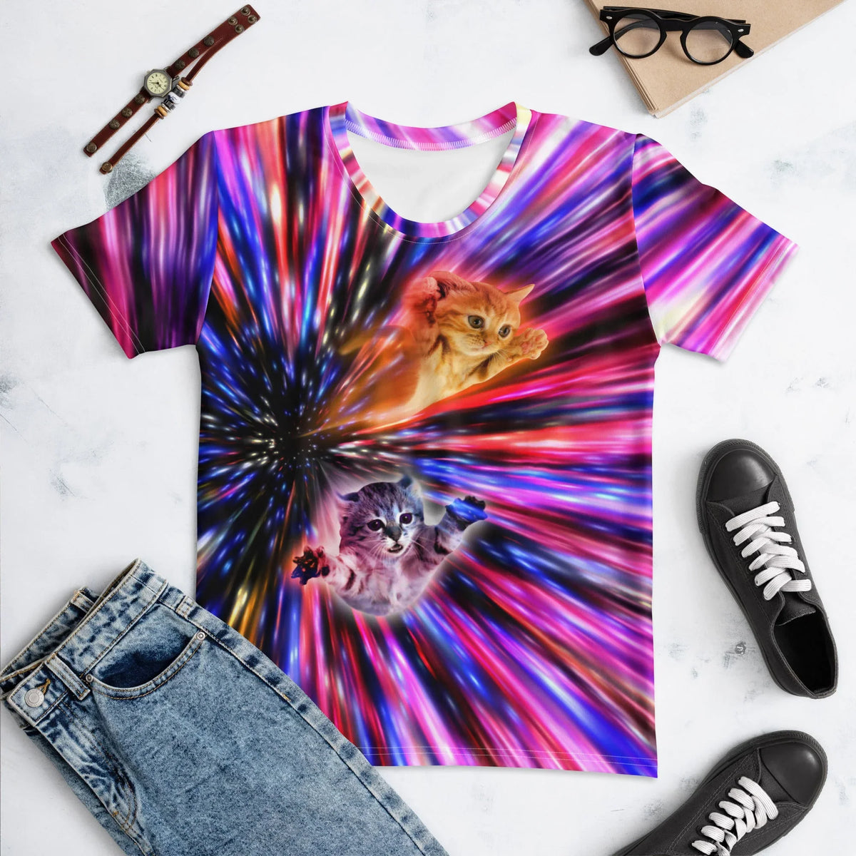 Two photorealistic kittens tumble through a chaotic psychedelic hyperspace tunnel, featuring a fluffy ginger tabby diving Superman-style alongside a wide-eyed grey companion. Contact us with accessibility feedback, we'd love to help!