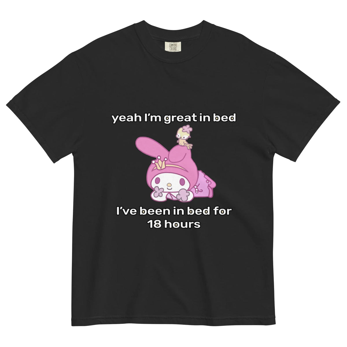 Great in Bed T-Shirt - The bait-and-switch contrast between the innocent #D86FA5 hooded rabbit on a #FFC5D3 pastel backdrop and the arched "Great in Bed" sexual innuendo text.