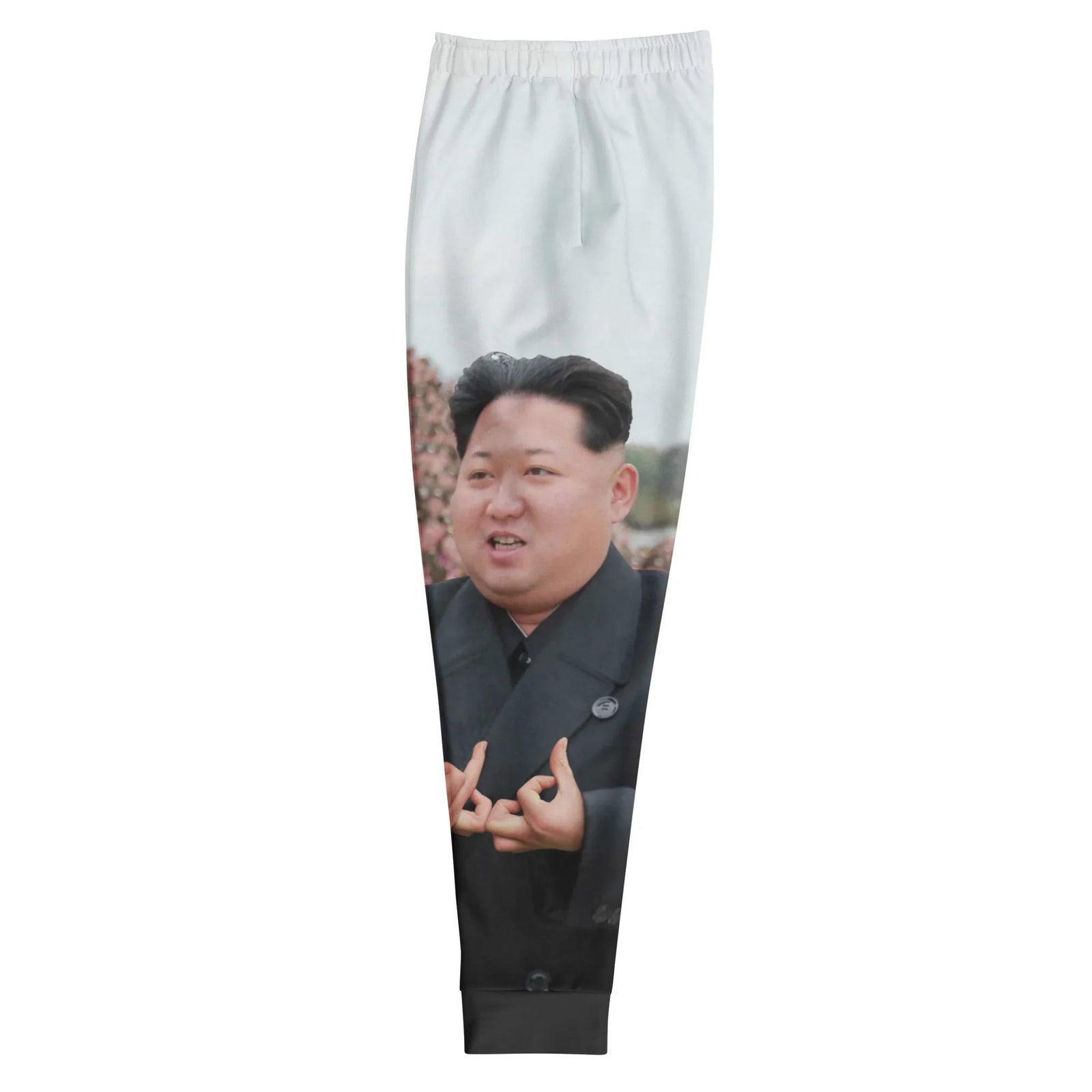 Kim Jong Represent Joggers - The digitally manipulated hand gestures imitating complex street culture signals, jarringly grafted onto the charcoal trench coat (#1C1C1C) of a stoic political figure, set against a backdrop of drab olive (#756650) military assembly under a pale cloud white (#E3E6E8) sky.