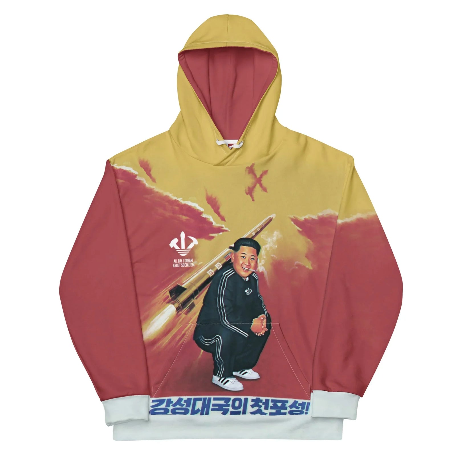A smiling supreme leader squats in a retro ink-black tracksuit (lit cigarette included) against a painterly horizon of dusty mustard gold and revolutionary crimson. Contact us with accessibility feedback, we'd love to help!