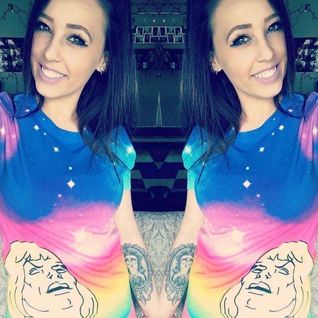 Master of the Galaxy Women's Tee - The pageboy-haired hero in a salmon pink vest (#FF91A4) with head thrown back in falsetto ecstasy against a sparkly rainbow backdrop featuring indigo nebulas (#2A005E), electric violet clouds (#8F00FF), and lemon yellow starbursts (#FFF700).