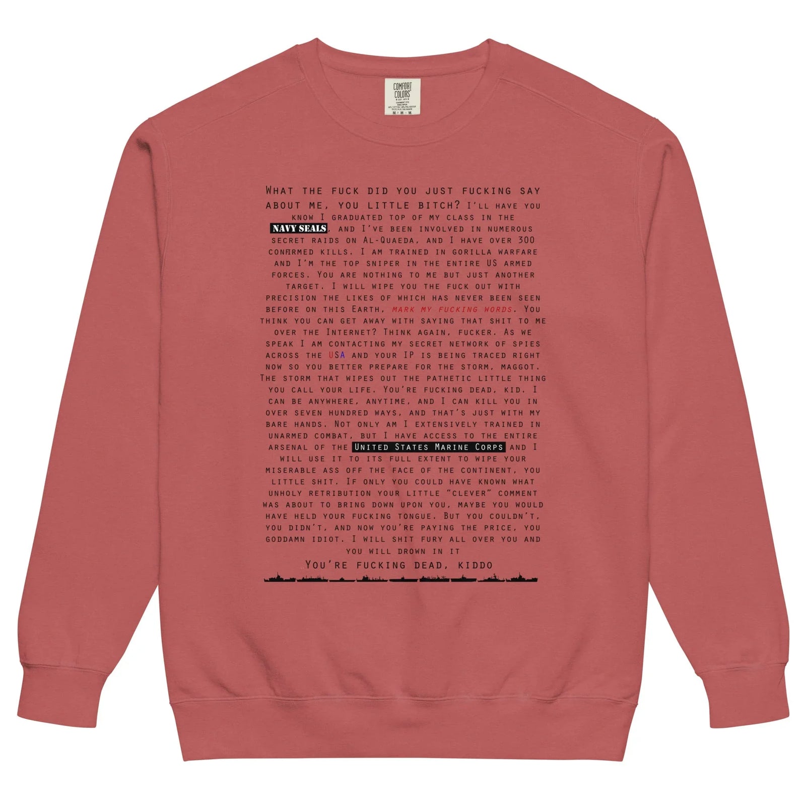 Close-up of dense tactical typography on vintage red cotton sweatshirt.