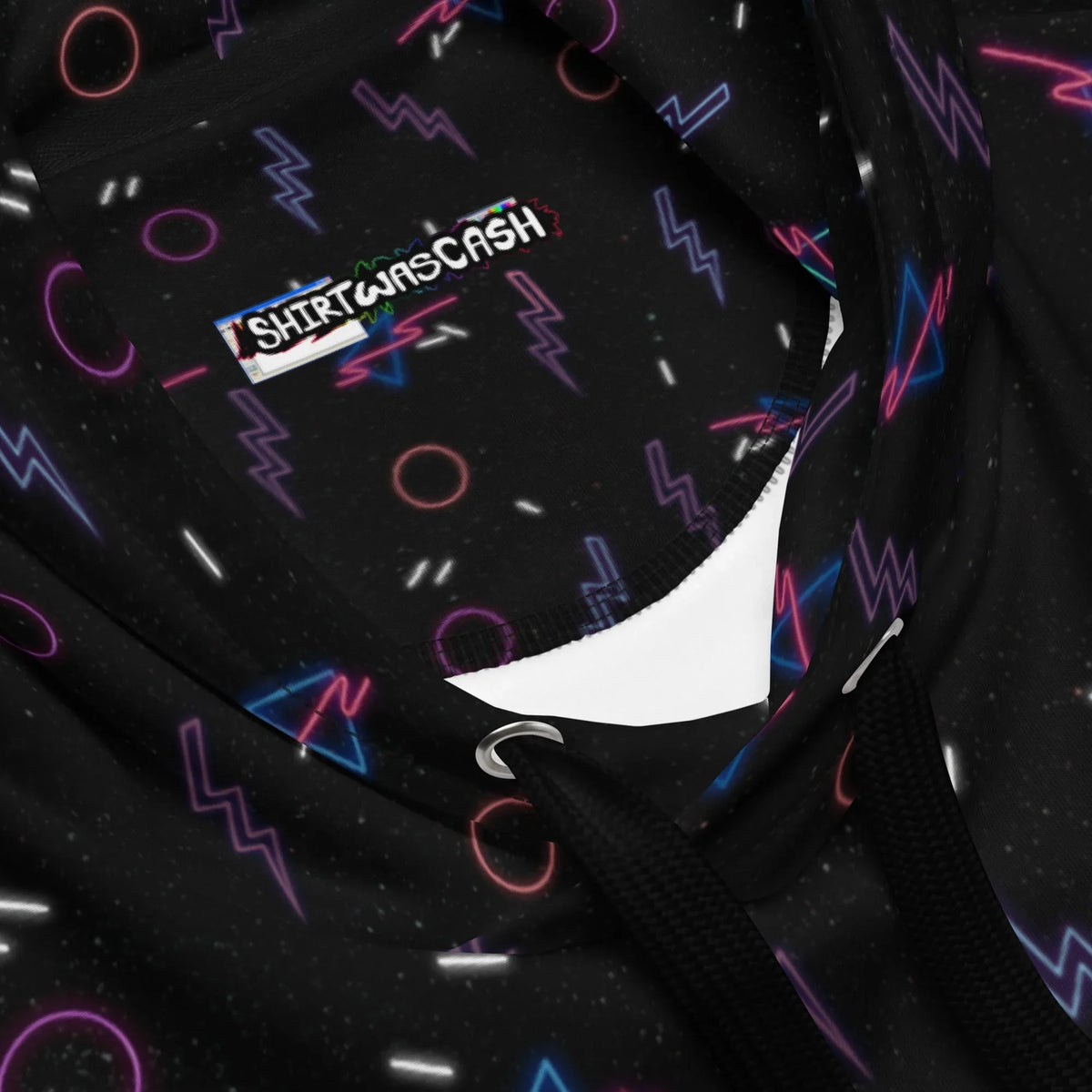 Retro Arcade Carpet Hoodie - The high-contrast "cosmic bowling" palette featuring jagged violet lightning (#8A2BE2), hollow hot magenta circles (#FF00FF), and electric cyan triangles (#00FFFF) against a void-black background (#0F0F0F), instantly mimicking the stain-hiding patterns of 1990s entertainment venues